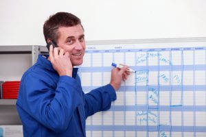 A manual worker working on his schedule.